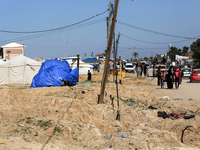 Displaced Palestinians are checking their belongings in the tiny coastal area of Al-Mawasi after Israeli tanks reportedly raided the sector,...