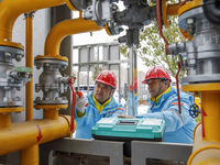 Workers are conducting a safety inspection of gas facilities and equipment at the Gas Gate station in Donghai County, Lianyungang city, East...