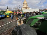 This photograph, taken in Paris, France, on February 23, 2024, shows tractors parked by French farmers during a demonstration led by the Coo...
