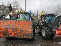 This photograph, taken in Paris, France, on February 23, 2024, shows tractors parked by French farmers during a demonstration led by the Coo...