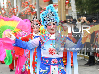Folk artists are performing a folk show on Xianfu Street in the Fushan district of Yantai, China, on February 24, 2024. (
