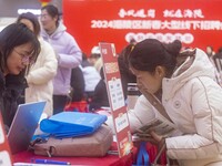 Job seekers are learning about jobs at a job fair in Taizhou, East China's Jiangsu province, on February 25, 2024. (