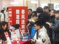 Job seekers are consulting at a large-scale job fair in Taizhou, East China's Jiangsu Province, on February 25, 2024. (