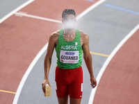Mohamed Ali Gouaned from Algeria, competing in the 800 metres, is spitting a fine mist of water before his semi-final at the 2024 World Athl...
