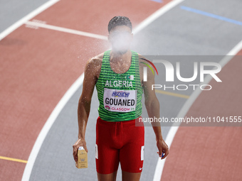 Mohamed Ali Gouaned from Algeria, competing in the 800 metres, is spitting a fine mist of water before his semi-final at the 2024 World Athl...
