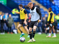 James Brophy #7 of Cambridge United is warming up before the match during the Sky Bet League 1 match between Bolton Wanderers and Cambridge...