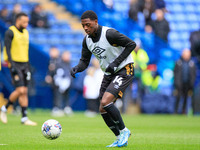 Sullay Kaikai #14 of Cambridge United is warming up before the match during the Sky Bet League 1 match between Bolton Wanderers and Cambridg...