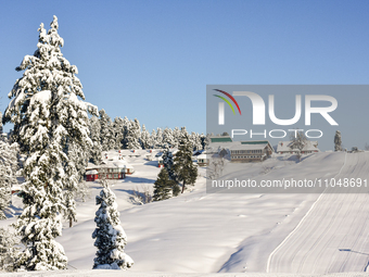 Hotels are seen in the morning after a snowstorm at Gulmarg Ski Resort in Baramulla district, Indian Administered Kashmir, on March 3, 2024....