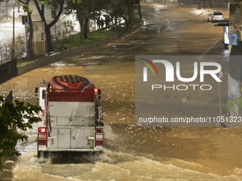 Heavy rain is flooding several streets in the central region of Sao Paulo, leaving people stranded in Sao Paulo, Brazil, on March 5, 2024. (