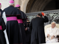 Pope Francis (R) is meeting with cardinals and bishops at the end of his weekly general audience in St. Peter's Square in the Vatican, on Ma...
