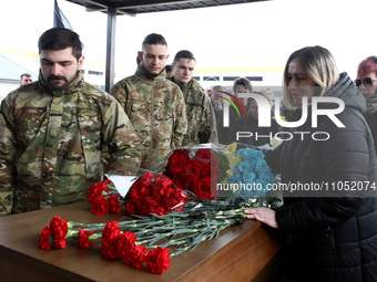 Members of the public are paying their last respects during the memorial service for Ukrainian defender Daniil Semenenko, who was killed in...