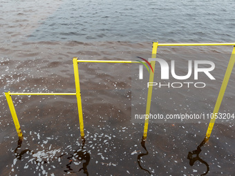 A horizontal bar is submerged in the area of Natalka Park in Kyiv, Ukraine, on March 6, 2024, due to increased water discharges from the Kyi...