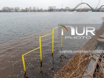 A horizontal bar is submerged in the area of Natalka Park in Kyiv, Ukraine, on March 6, 2024, due to increased water discharges from the Kyi...