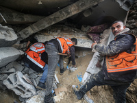 Palestinians are inspecting the damage at a home in Deir al-Balah in the central Gaza Strip on March 7, 2024, which was hit during an Israel...