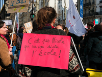 Protesters are holding a sign against the Minister of Education Nicole Belloubet during a demonstration demanding an emergency plan for the...