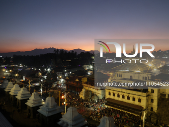 The Pashupatinath Temple is being decorated with lights for the Maha Shivaratri festival at the Pashupatinath Temple complex in Kathmandu, N...
