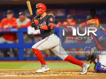Ildemaro Vargas, #14 of the Washington Nationals, is hitting a single during the second inning of the baseball game against the New York Met...