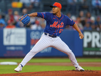 New York Mets starting pitcher Jose Quintana #62 is throwing during the first inning of a baseball game against the Washington Nationals at...