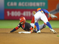 New York Mets shortstop Francisco Lindor #12 is tagging out Washington Nationals' Carter Kieboom #8 during the fourth inning of a baseball g...