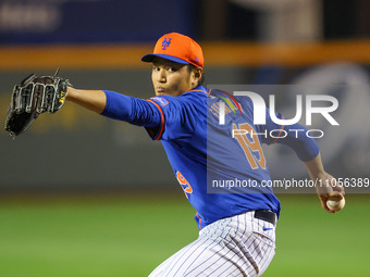 New York Mets pitcher Shintaro Fujinami #19 is throwing during the seventh inning of a baseball game against the Washington Nationals at Clo...