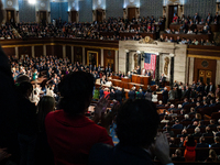 Lawmakers and guests give President Joe Biden a standing ovation during the annual State of the Union address to a joint session of Congress...
