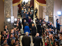Senators walk through a gauntlet of media to the chamber of the House of Representatives where President Joe Biden will deliver the annual S...