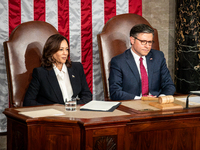 Vice President Kamala Harris and House Speaker Mike Johnson sit behind President Joe Biden as he delivers the annual State of the Union addr...