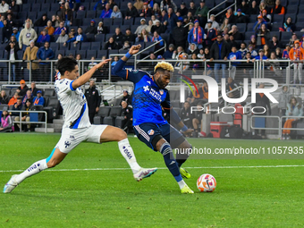 Cincinnati forward Aaron Boupendza is taking a shot on goal during the 2024 Concacaf Champions Cup Round of 16 match between FC Cincinnati a...