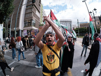 Students and feminist activists are holding Palestinian flags in support of Palestinian women at a protest against patriarchy and violence i...