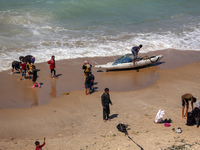 Palestinians are enjoying the beach in Deir Al-Balah, Central Gaza Strip, on March 8, 2024, while battles are continuing between Israel and...