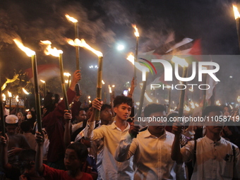 Muslims are welcoming the arrival of the month of Ramadan by holding a torchlight parade on Brigadier General Katamso Street in Medan, North...