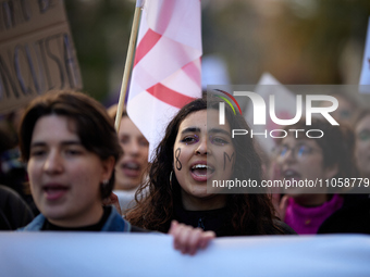 A woman is shouting slogans during the International Women's Day demonstration in Granada, Spain, on March 8, 2024. International Women's Da...