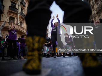 A group of protesters are dancing at the head of the demonstration in Granada, Spain, on March 8, 2024, during International Women's Day. In...