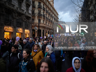 Thousands of people are walking along Gran Via Street during the International Women's Day demonstration in Granada, Spain, on March 8, 2024...