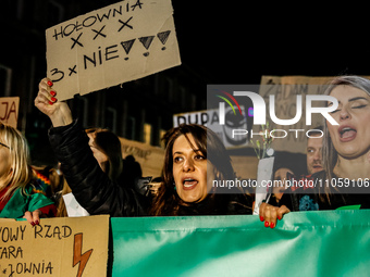 Women rights activists  from the Women's Hell organisation and their supporters hold banners and chant pro-choice slogans during a protest i...
