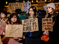 Women rights activists  from the Women's Hell organisation and their supporters hold banners during a protest in front of the Presidential P...