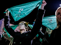 Women rights activists  from the Women's Hell organisation and their supporters hold green scarfs and chant pro-choice slogans during a prot...