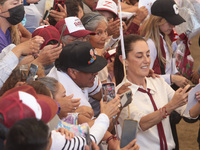 Claudia Sheinbaum, candidate for the Presidency of Mexico for the Let's Make History coalition, is taking a selfie during a political rally...