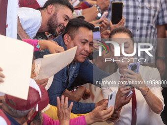 Claudia Sheinbaum, candidate for the Presidency of Mexico for the Let's Make History coalition, is taking a selfie during a political rally...