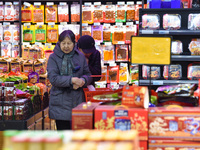 Citizens are shopping at a supermarket in Nanjing, East China's Jiangsu province, on March 9, 2024. China's consumer price index has risen 0...