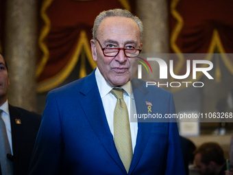 Senate Majority Leader Chuck Schumer (D-NY) walks to the House chamber with his colleagues to hear President Joe Biden delivers the annual S...
