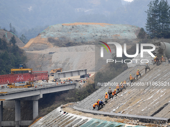 Workers are working at the construction site of the Jinsha-Tongzi Expressway (Renhuai section) in Zunyi, China, on March 10, 2024. (