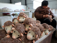 A worker is producing toys for export at a workshop of a toy company in Binzhou, Shandong Province, China, on March 10, 2024. (