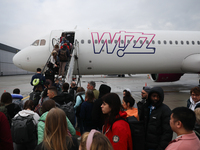 People board Wizz Air plane on the airport in Katowice, Poland on February 28, 2024. (