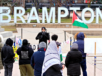 Anas Sial, the leader of the grassroots organization Action for Palestine, is speaking to a small crowd in Ken Whillans Square beside the ci...