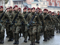 Polish soldiers march as they celebrate the 25. anniversary of Poland joining North Atlantic alliance in the Main Square in Old Town of Krak...