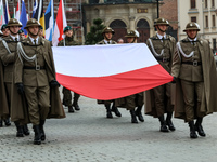 Polish soldiers hold Polish and NATO and NATO members' flags as they celebrate the 25. anniversary of Poland joining North Atlantic alliance...