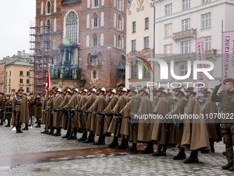 Polish soldiers shoot a salve as they celebrate the 25. anniversary of Poland joining North Atlantic alliance in the Main Square in Old Town...