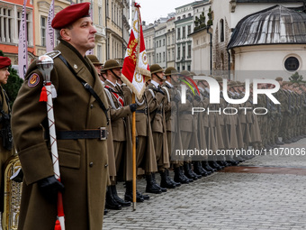 Polish soldiers celebrate the 25. anniversary of Poland joining North Atlantic alliance in the Main Square in Old Town of Krakow, Poland on...