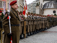 Polish soldiers celebrate the 25. anniversary of Poland joining North Atlantic alliance in the Main Square in Old Town of Krakow, Poland on...